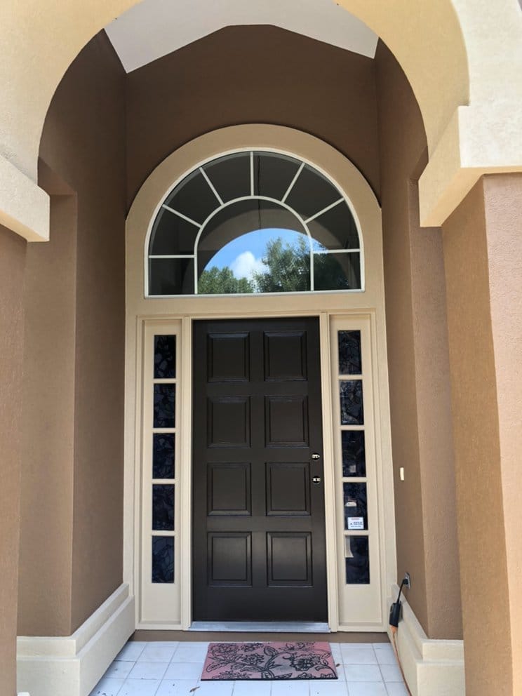 Front door refinished to match stucco home trim
